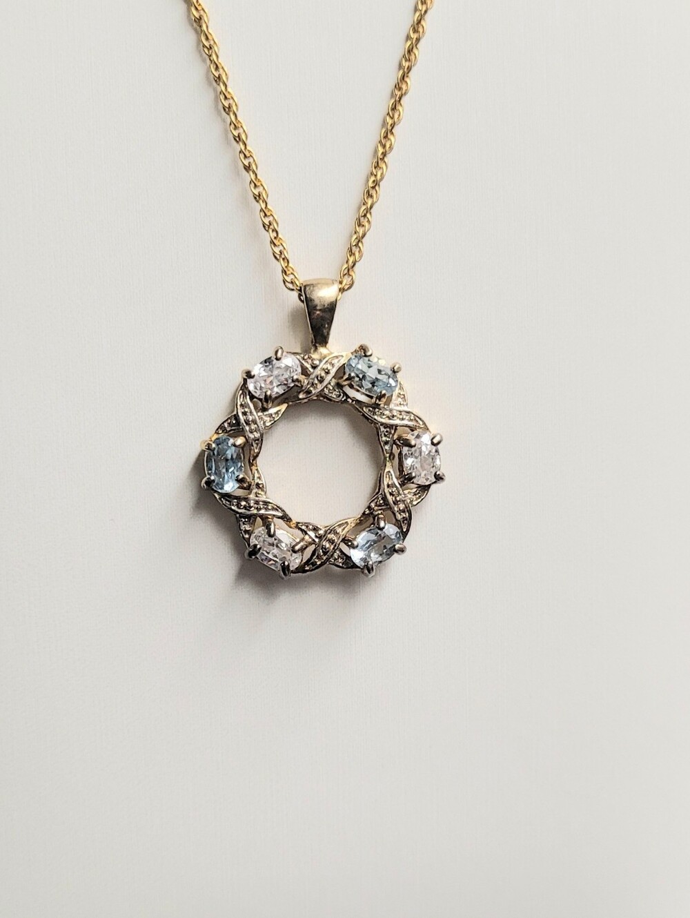 Gold Circle Unique Vintage Pendant Necklace with Clear and Light Blue Stones